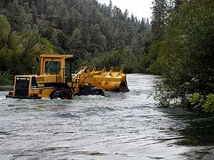 Spreading Gravel in River